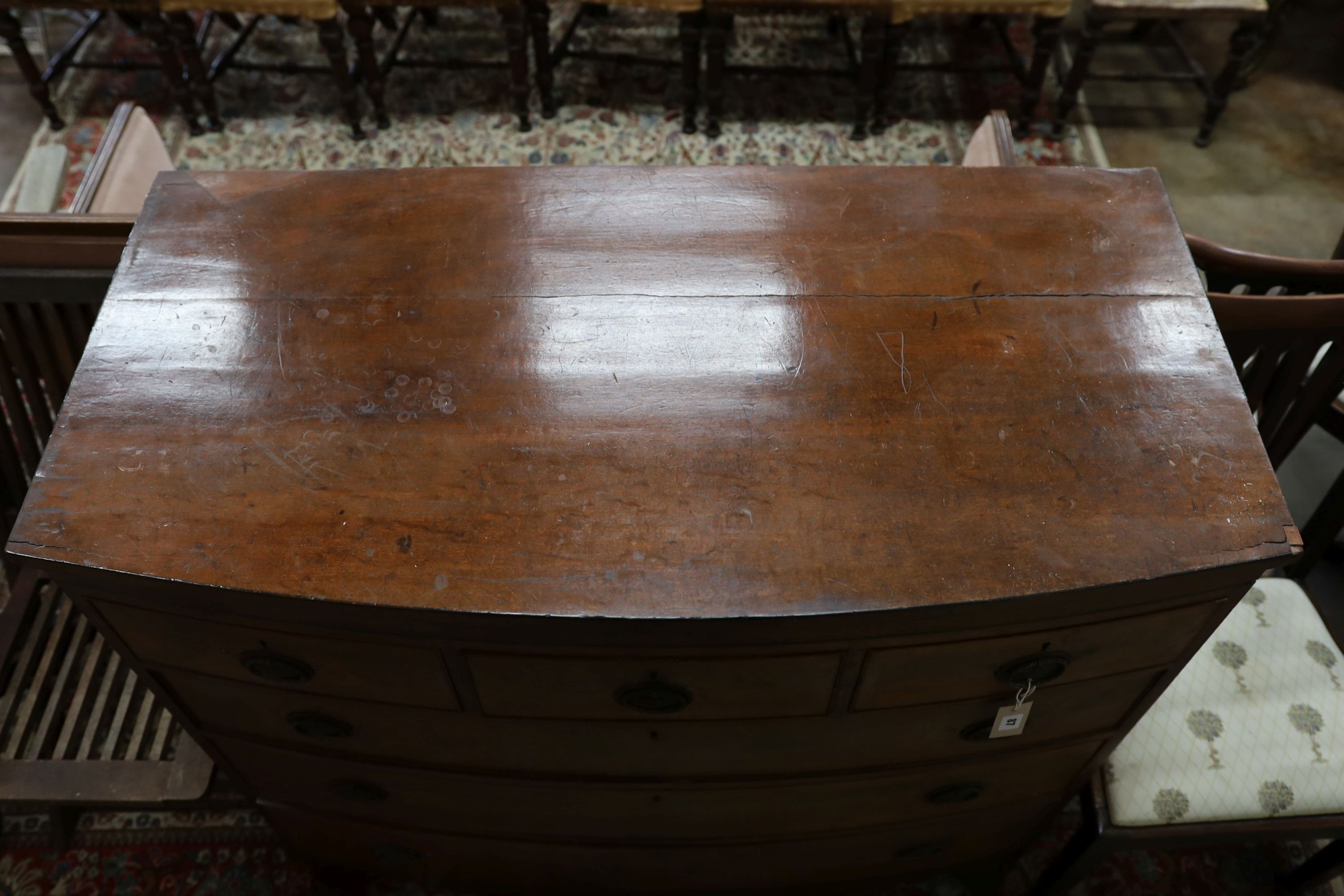 A Georgian mahogany bow fronted chest, fitted three short drawers and three long drawers on splayed bracket feet, width 115cm, depth 56cm, height 111cm